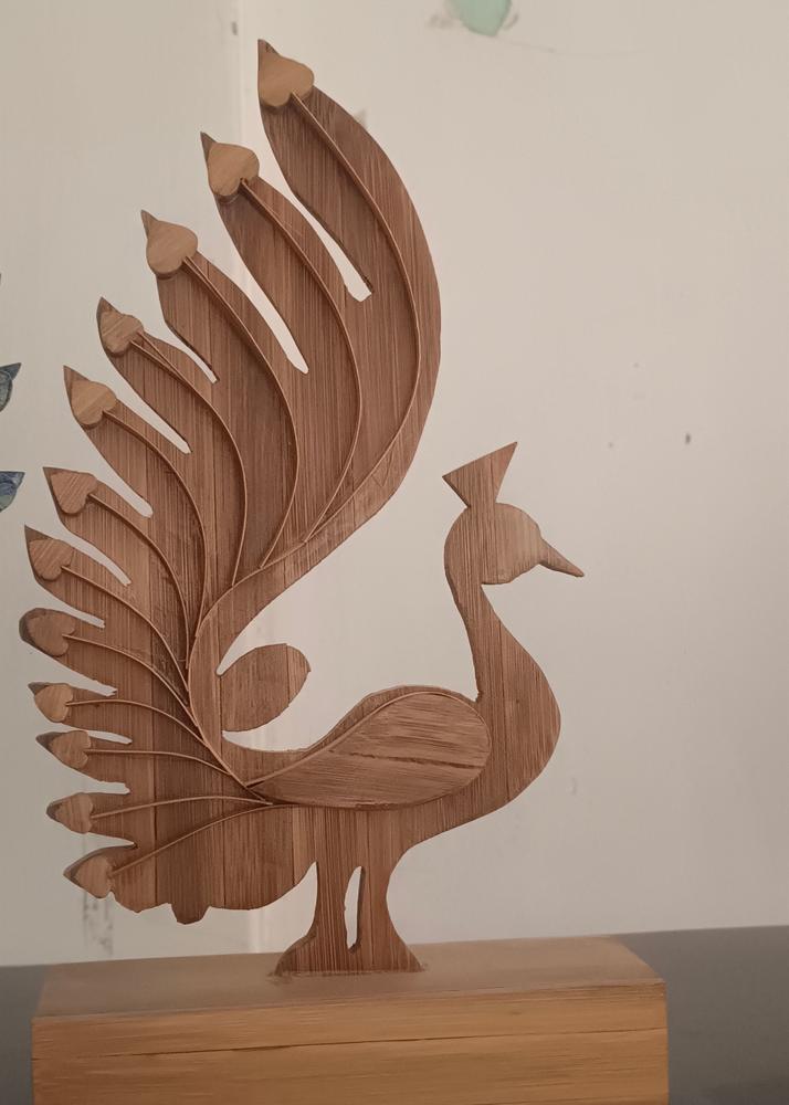 Carved bamboo peacock